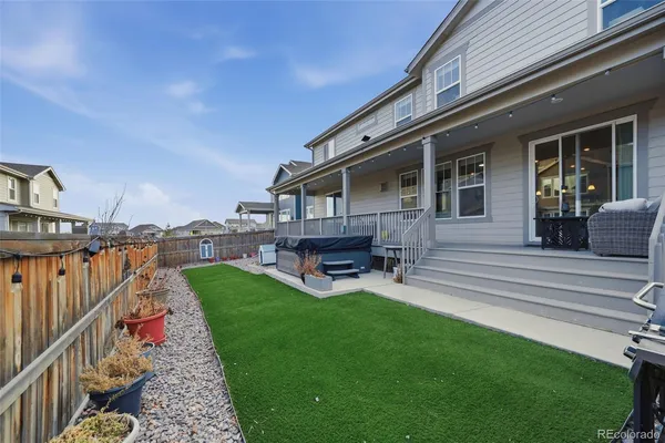 a house view with a seating space and garden