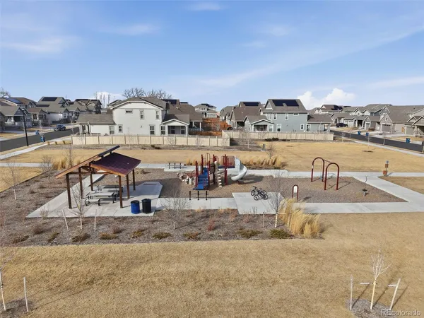 an aerial view of residential houses with outdoor space