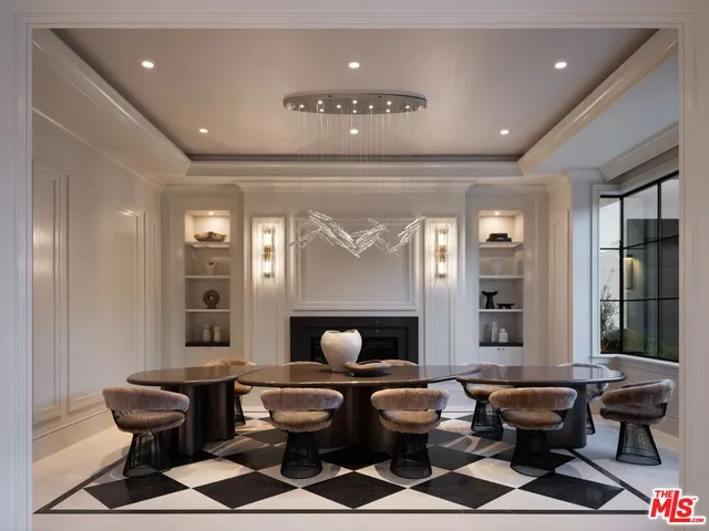 a living room with furniture and large windows