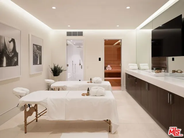 a living room with couches and painted walls