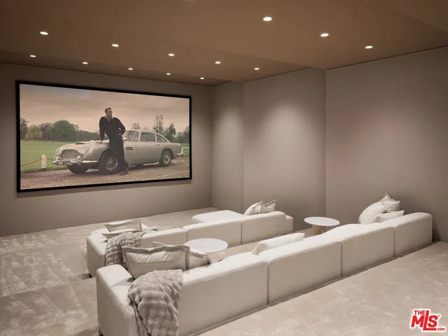 a view of a roof deck with couches and potted plants