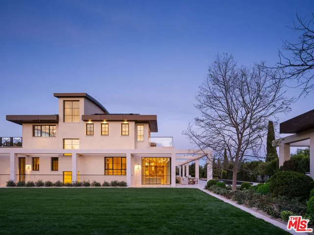 a view of a house with a street