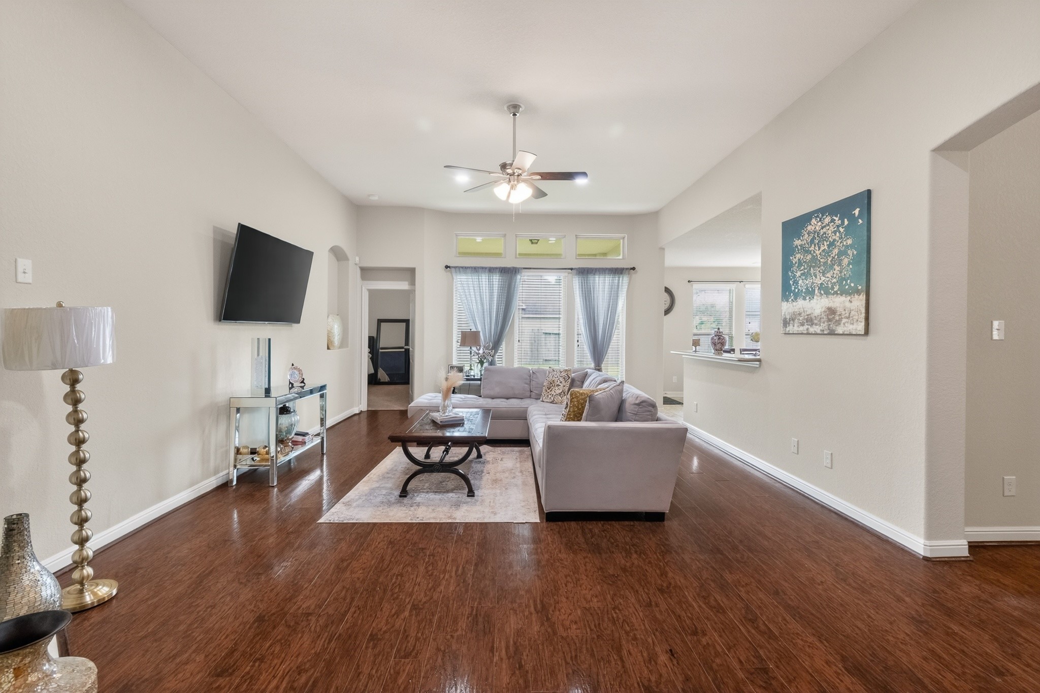 24711 East Burnaby Circle Spring, TX 77373 - Photo 4 of 20 a living room with furniture or chandelier and a wooden floor
