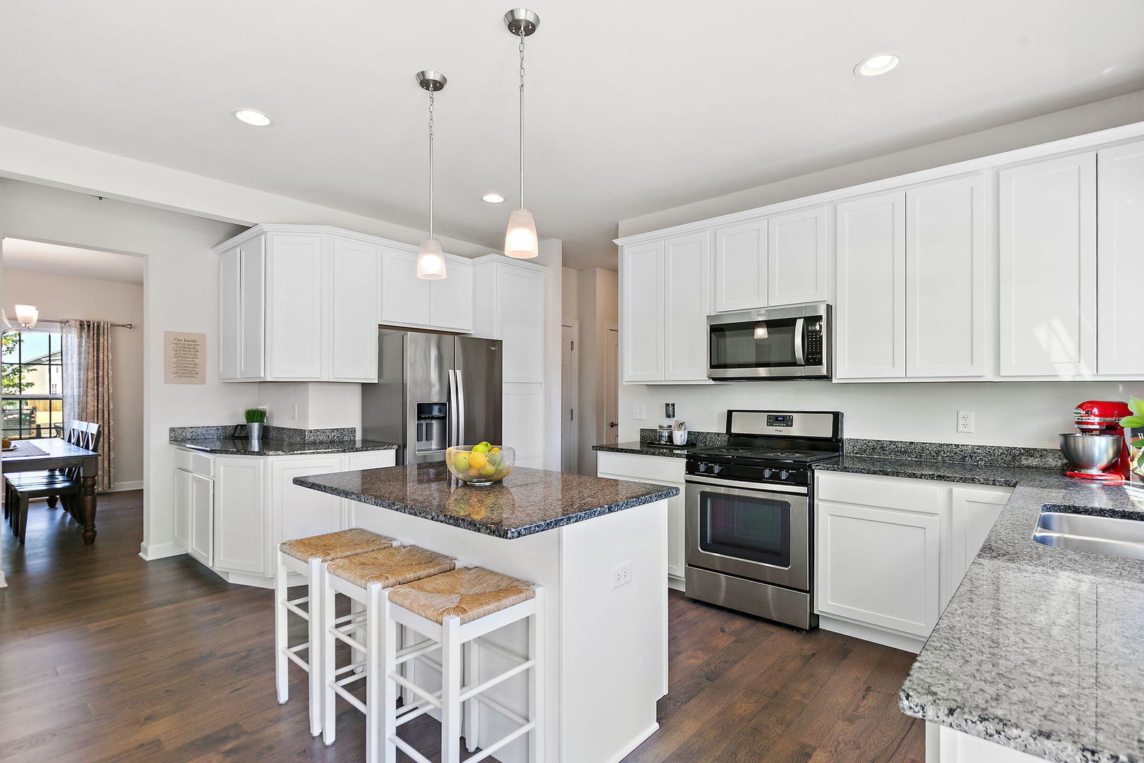 1109 Nottingham Road Sycamore, IL 60178 - Photo 14 of 44 a kitchen with white cabinets stainless steel appliances and wooden floor