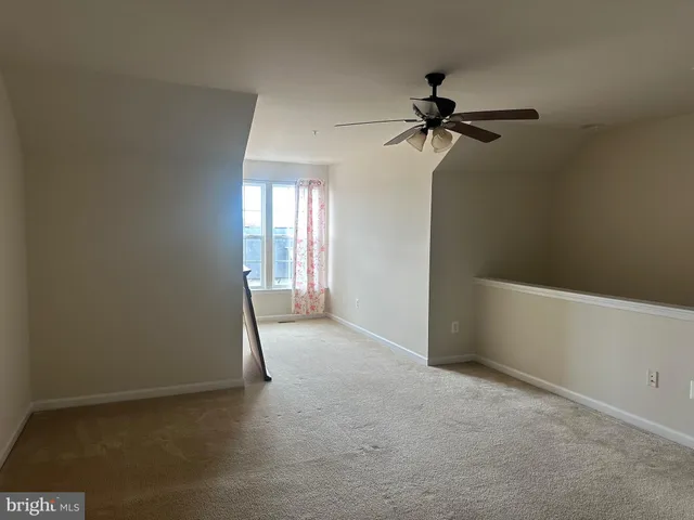 a view of empty room with windows