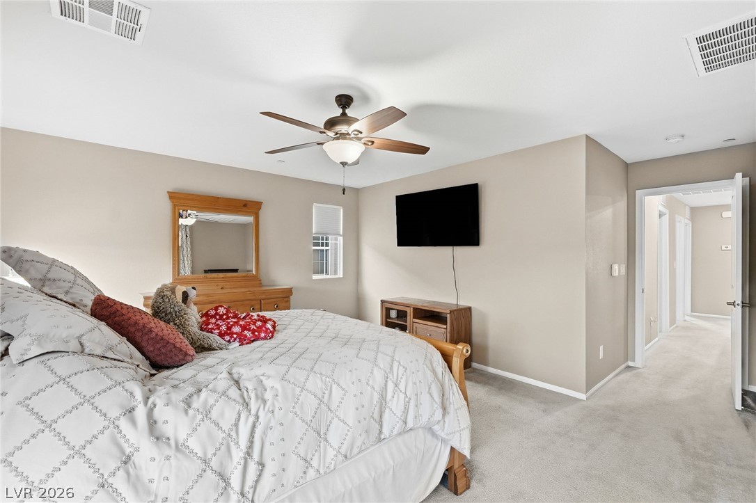 150 Fulgora Street Henderson, NV 89074 - Photo 45 of 92 Bedroom featuring light colored carpet and ceiling fan