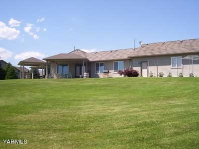 12216 West Barrett Road Yakima, WA 98908 - Photo 2 of 21 a view of a house with a yard porch and sitting area