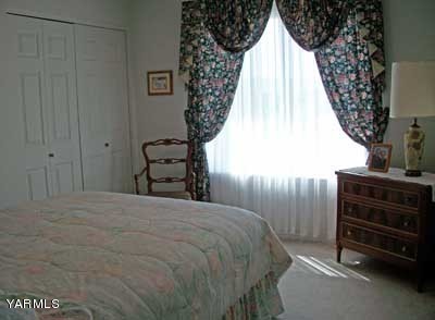 12216 West Barrett Road Yakima, WA 98908 - Photo 12 of 21 a bedroom with a bed and a dresser