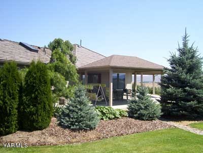 12216 West Barrett Road Yakima, WA 98908 - Photo 17 of 21 a front view of a house with a yard