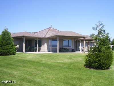 12216 West Barrett Road Yakima, WA 98908 - Photo 18 of 21 a front view of a house with a garden