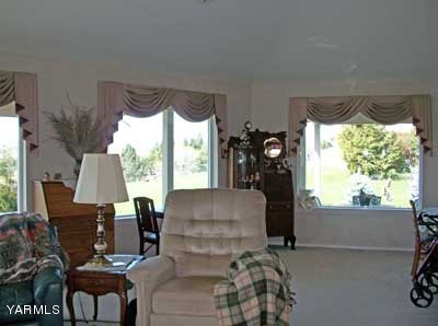 12216 West Barrett Road Yakima, WA 98908 - Photo 5 of 21 a living room with furniture and a large window
