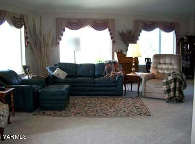 12216 West Barrett Road Yakima, WA 98908 - Photo 6 of 21 a living room with furniture and a large window