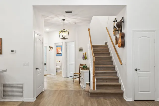 a view of entryway with furniture and wooden floor