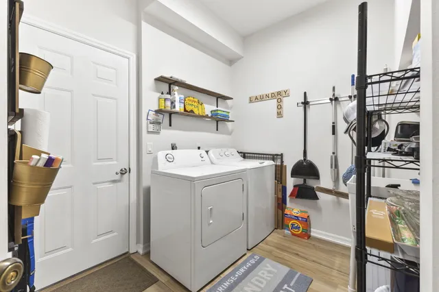 a utility room with multiple dryer and washer