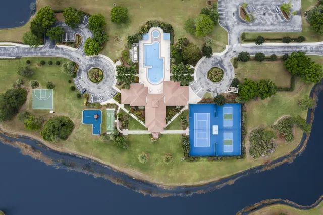 an aerial view of a house with swimming pool patio and outdoor seating
