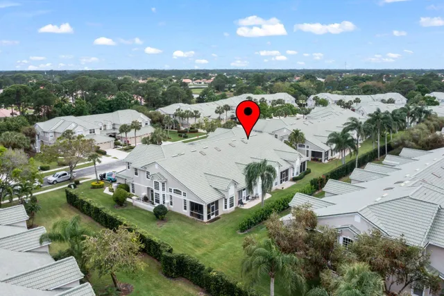 an aerial view of a house with a swimming pool