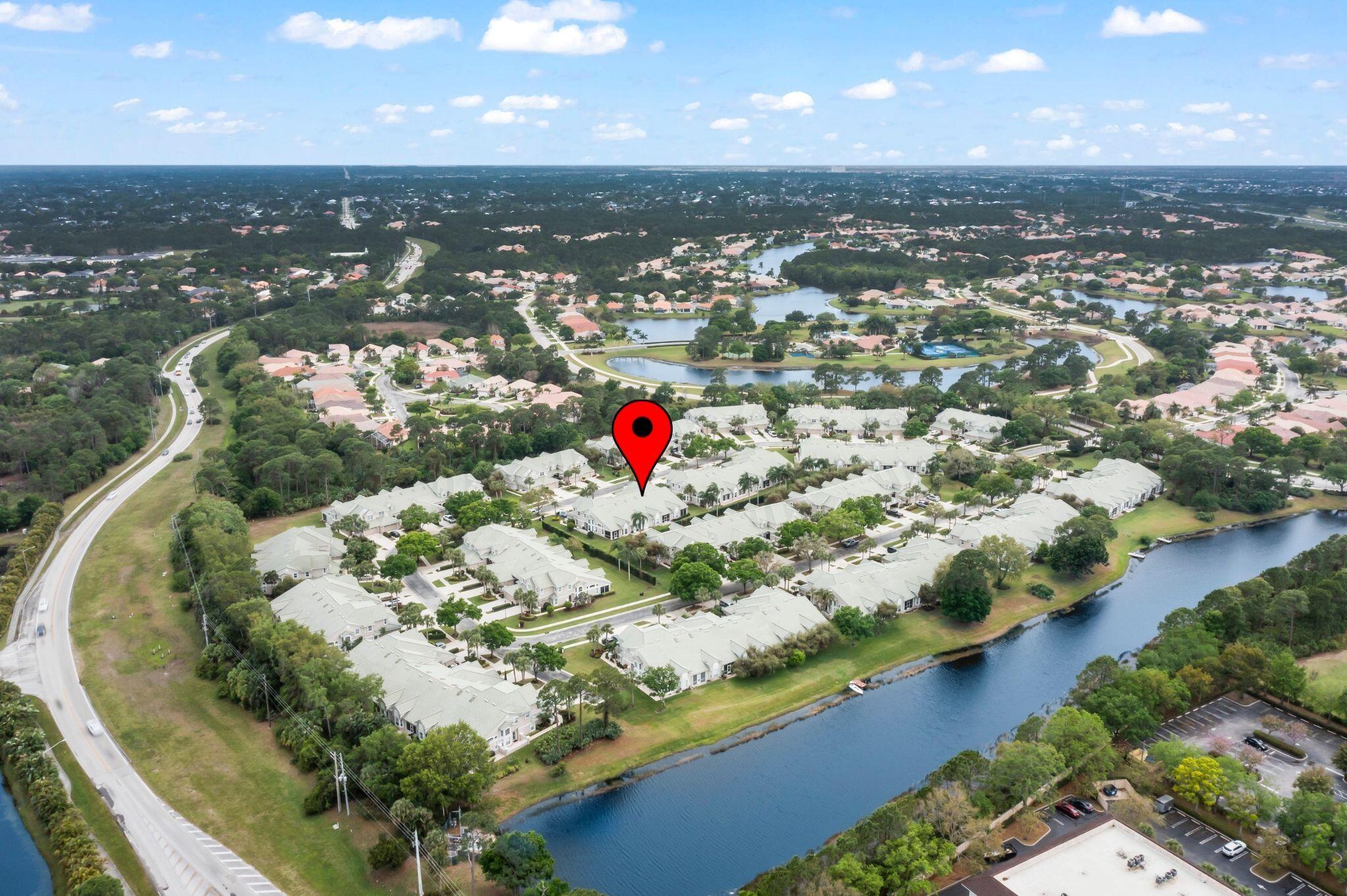 1604 Southwest Harbour Isles Circle, Unit 82 Port St. Lucie, FL 34986 - Photo 29 of 38 an aerial view of a house with a swimming pool