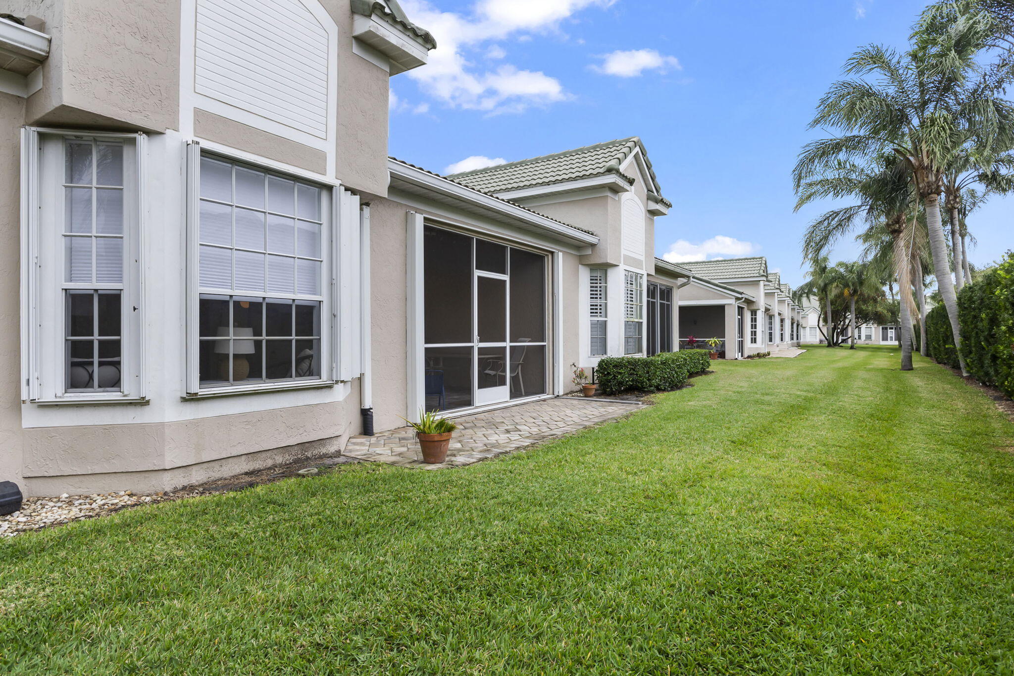 1604 Southwest Harbour Isles Circle, Unit 82 Port St. Lucie, FL 34986 - Photo 32 of 38 a view of house with yard and front view of a house