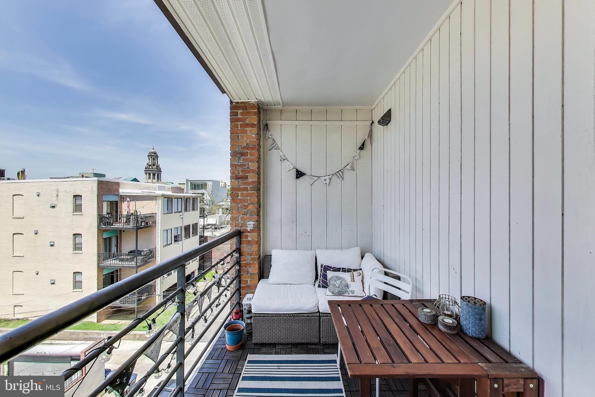 1461 Girard Street Northwest, Unit 400 Washington, DC 20009 - Photo 12 of 13 a view of balcony with furniture