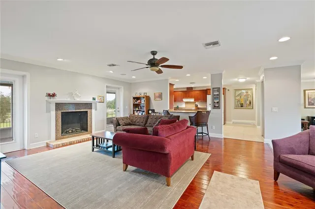 a living room with furniture fireplace and window