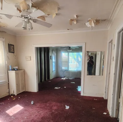 a view of a hallway with a dining space