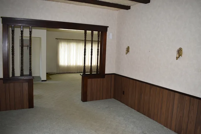 a view of an empty room and window