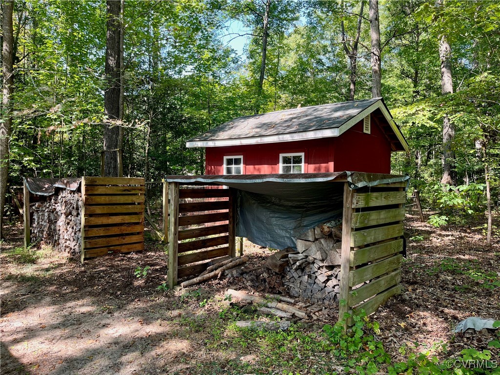 9611 Old Forge Road Providence Forge, VA 23140 - Photo 18 of 38 a view of a house with a backyard