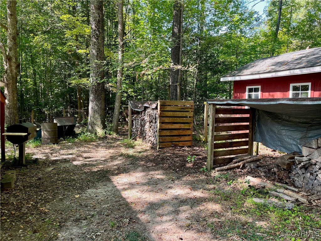9611 Old Forge Road Providence Forge, VA 23140 - Photo 19 of 38 a front view of a house with a garden