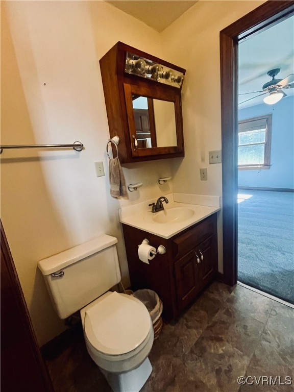 9611 Old Forge Road Providence Forge, VA 23140 - Photo 31 of 38 a bathroom with a toilet a sink and mirror