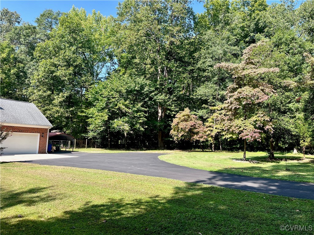 9611 Old Forge Road Providence Forge, VA 23140 - Photo 8 of 38 a view of a house with a swimming pool
