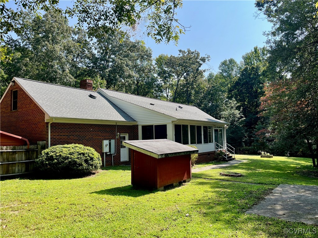 9611 Old Forge Road Providence Forge, VA 23140 - Photo 10 of 38 a front view of a house with a yard and trees