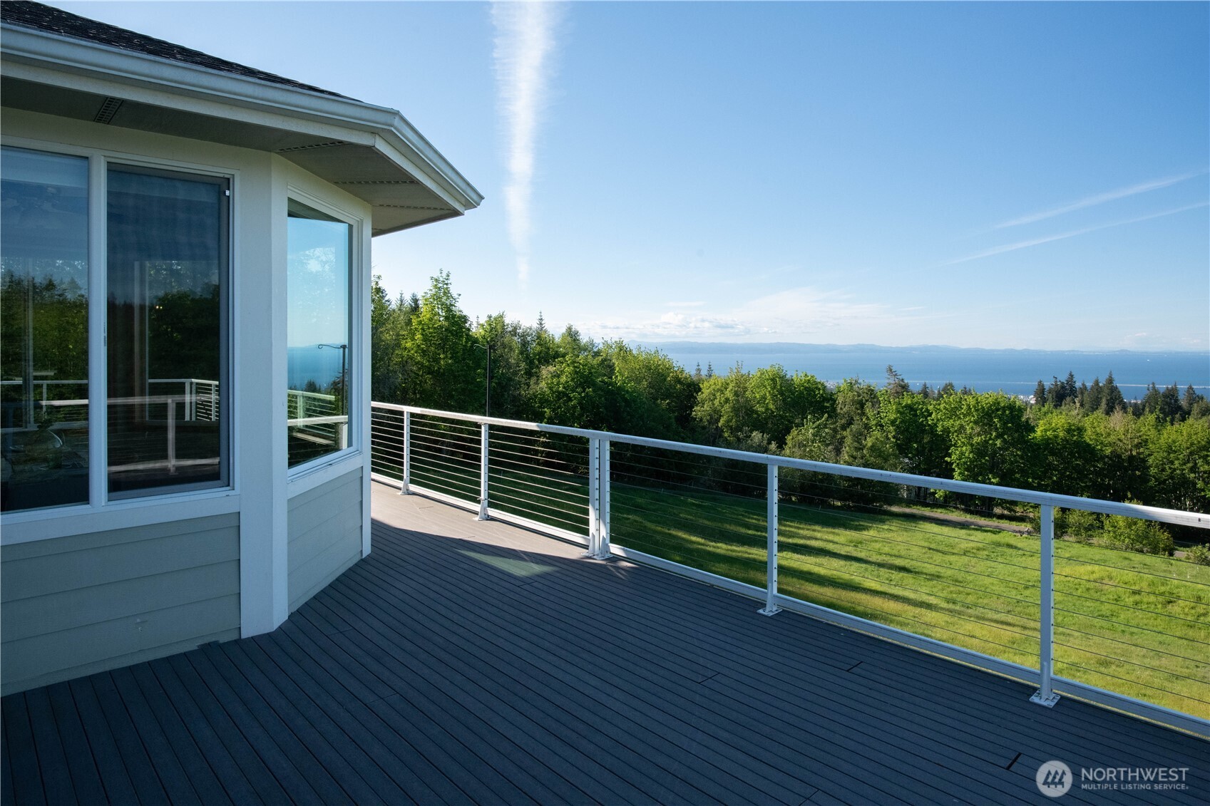 975 Simmons Road Port Angeles, WA 98362 - Photo 23 of 40 a view of a roof deck with wooden floor and fence