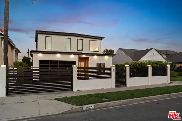 a front view of a house with a garage