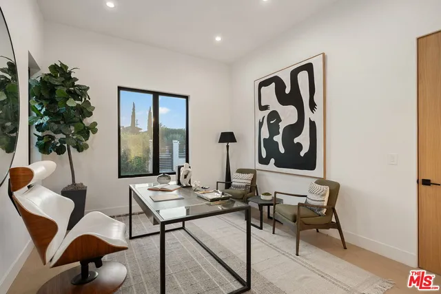 a hallway with a view of living room