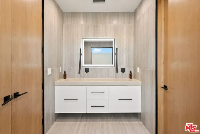 a bathroom with a bathtub and a sink