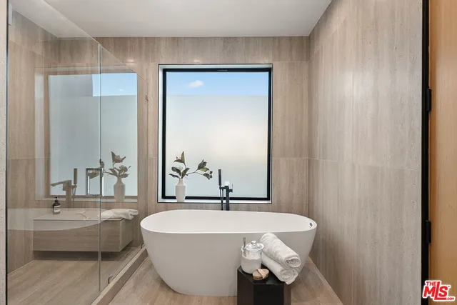 a bedroom with bed and a dresser