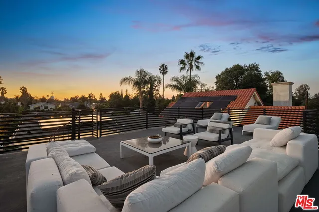 a view of a wooden house with a small yard