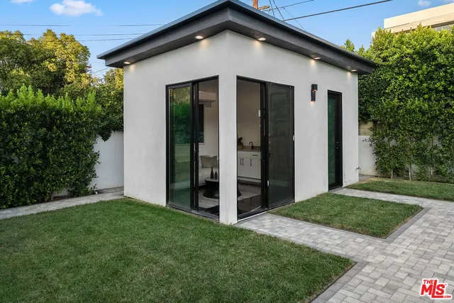 a terrace of a house with outdoor seating
