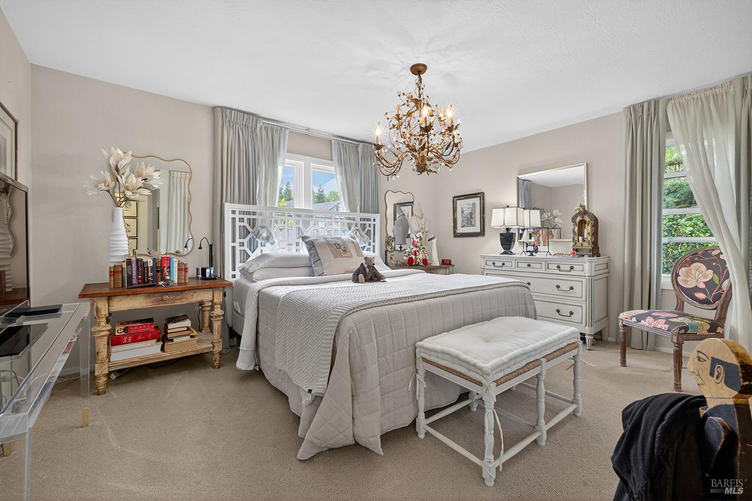 1832 Wright Street Santa Rosa, CA 95404 - Photo 12 of 25 a bedroom with a bed and a chandelier