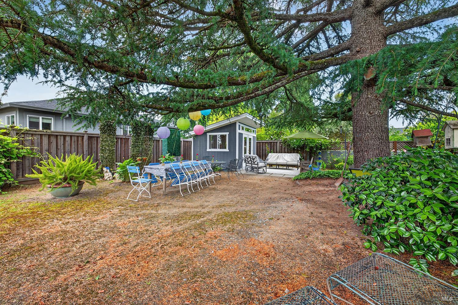 1832 Wright Street Santa Rosa, CA 95404 - Photo 22 of 25 a view of a chair and tables in the patio next to a road