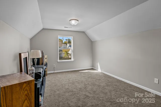 a view of workspace with furniture and a window