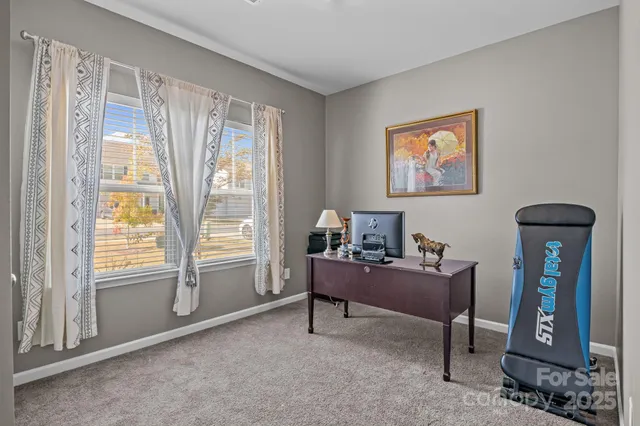 a workspace with furniture and window