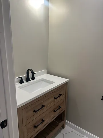 a view of an empty room with glass door