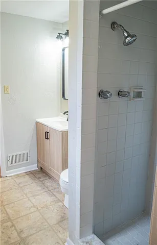 an empty room with wooden floor and door