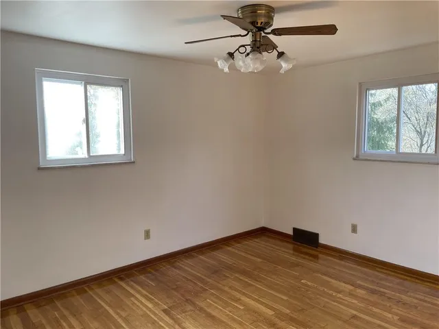 a bathroom with a toilet and a bathtub