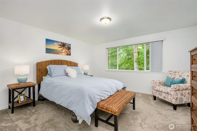 a bedroom with a bed and a couch