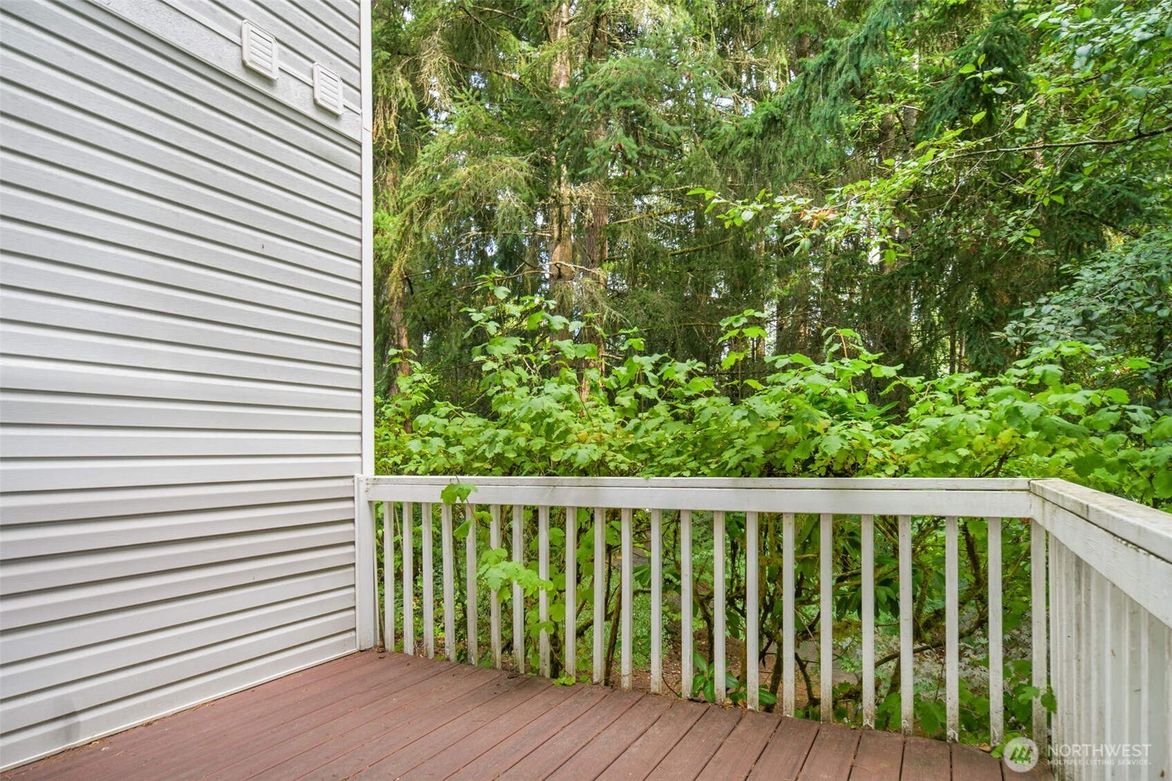4748 Lakeshore Lane Southeast, Unit B Olympia, WA 98513 - Photo 21 of 31 a view of a wooden fence