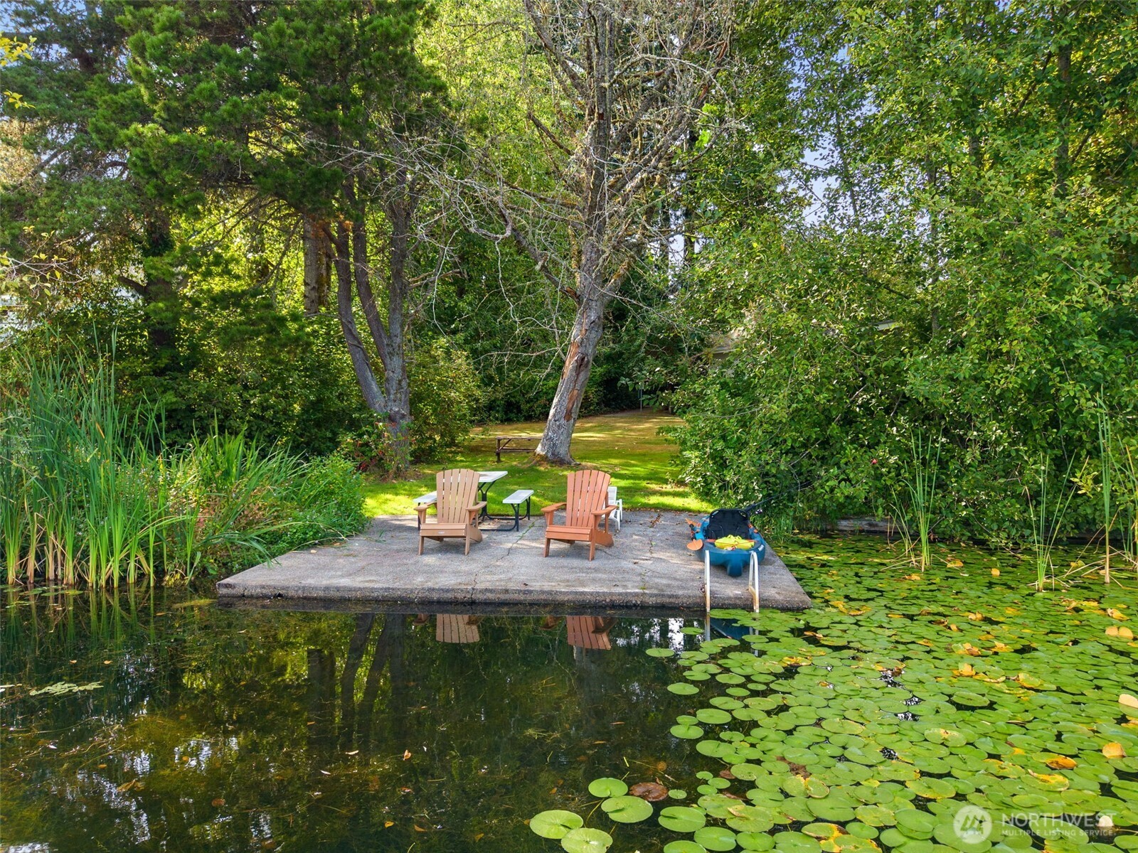 4748 Lakeshore Lane Southeast, Unit B Olympia, WA 98513 - Photo 29 of 31 a view of a house with a yard