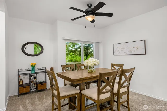 a dining room with furniture and window