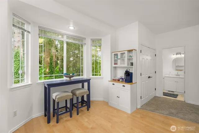 a view of a livingroom with furniture window and front door